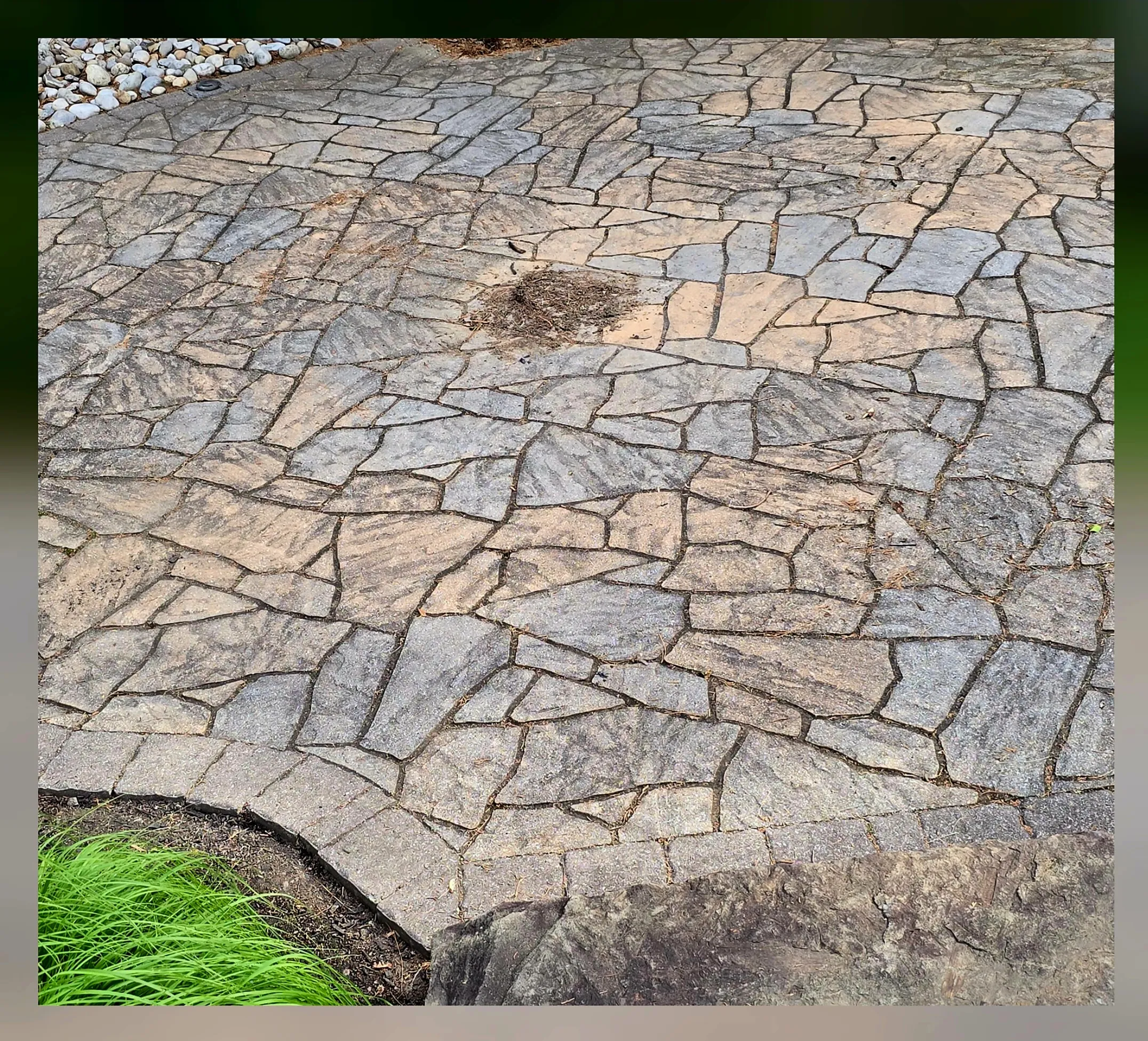 Flagstone patio before cleaning — deteriorated and stained flagstone surface