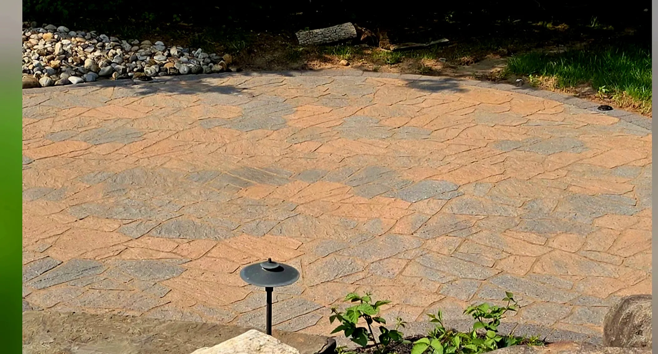 Flagstone patio after cleaning — restored and sealed flagstone patio